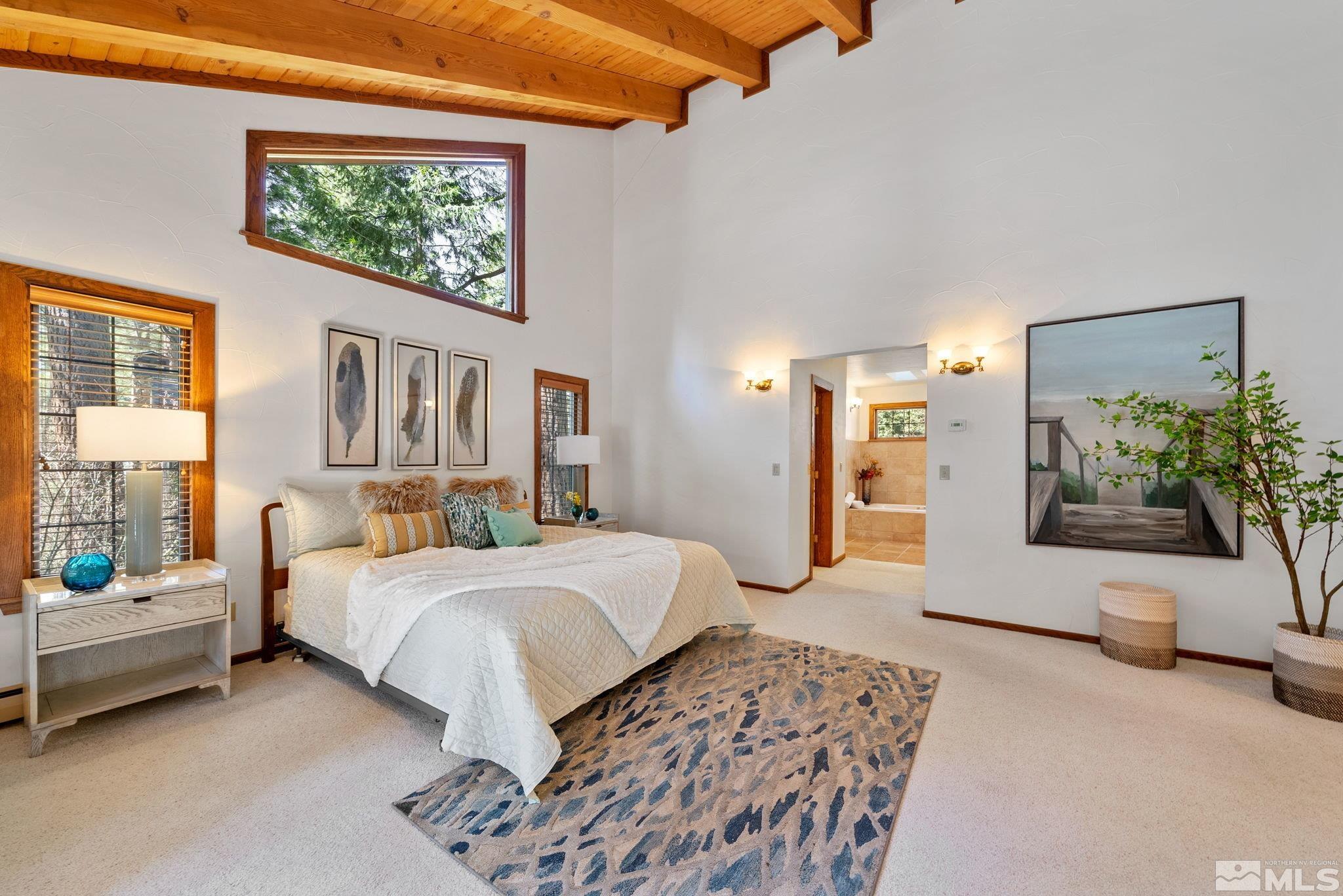 106 Jobs Peak Road Incline Village, NV 89451 - Photo 16 of 40 a bedroom with a large bed and a couch