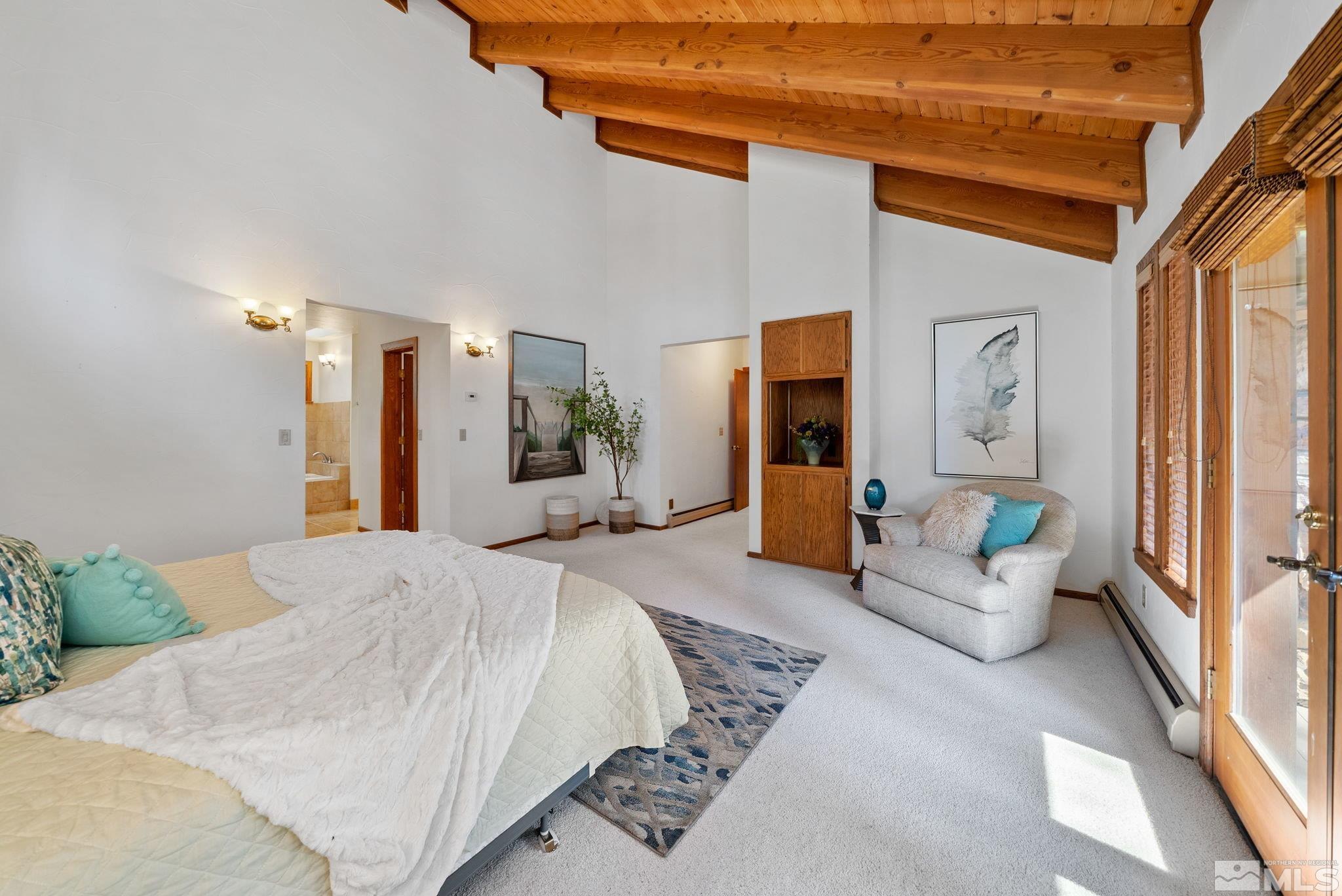 106 Jobs Peak Road Incline Village, NV 89451 - Photo 18 of 40 a spacious bedroom with a bed and glass door