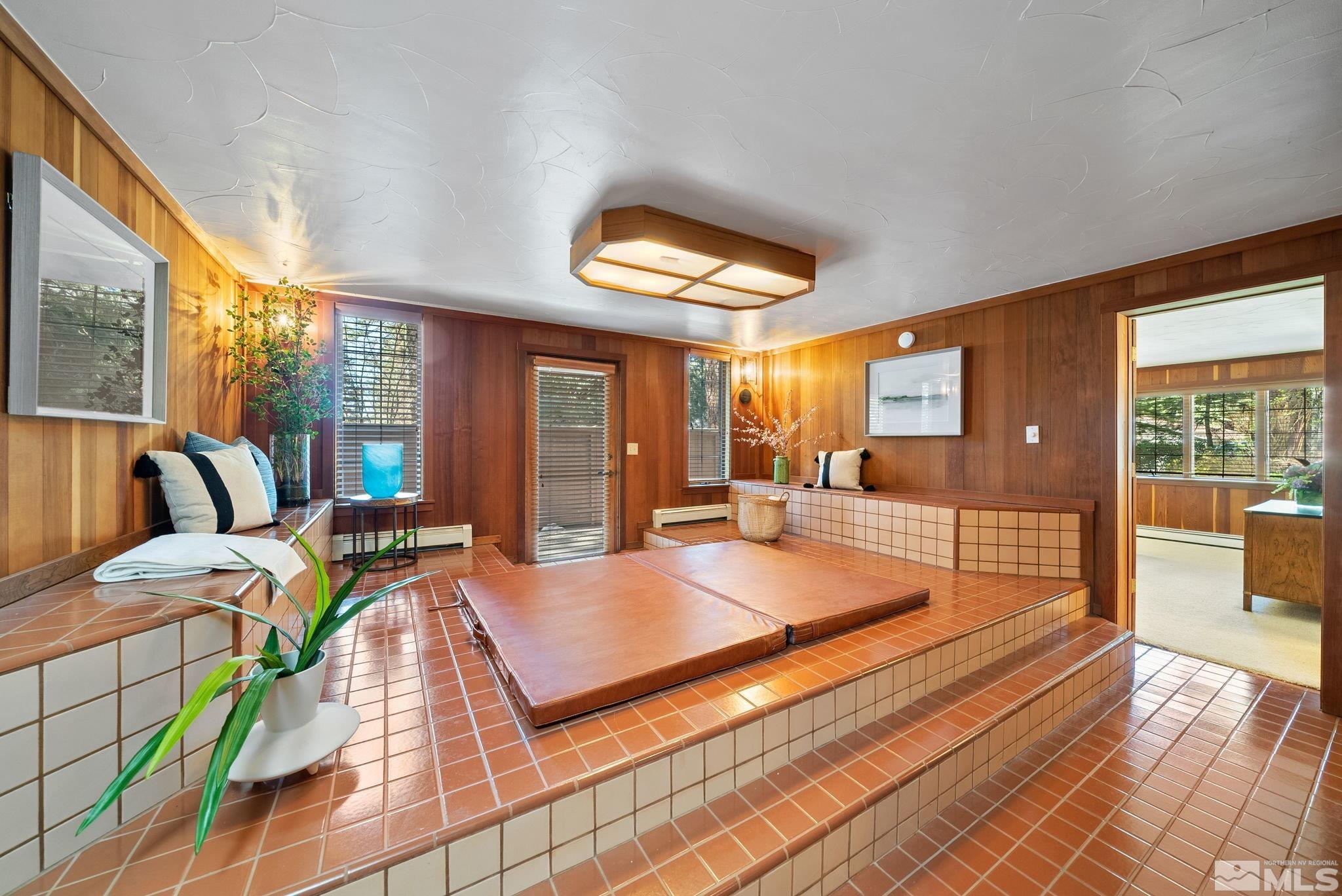 106 Jobs Peak Road Incline Village, NV 89451 - Photo 21 of 40 a spacious bedroom with a bed and large windows with outer view