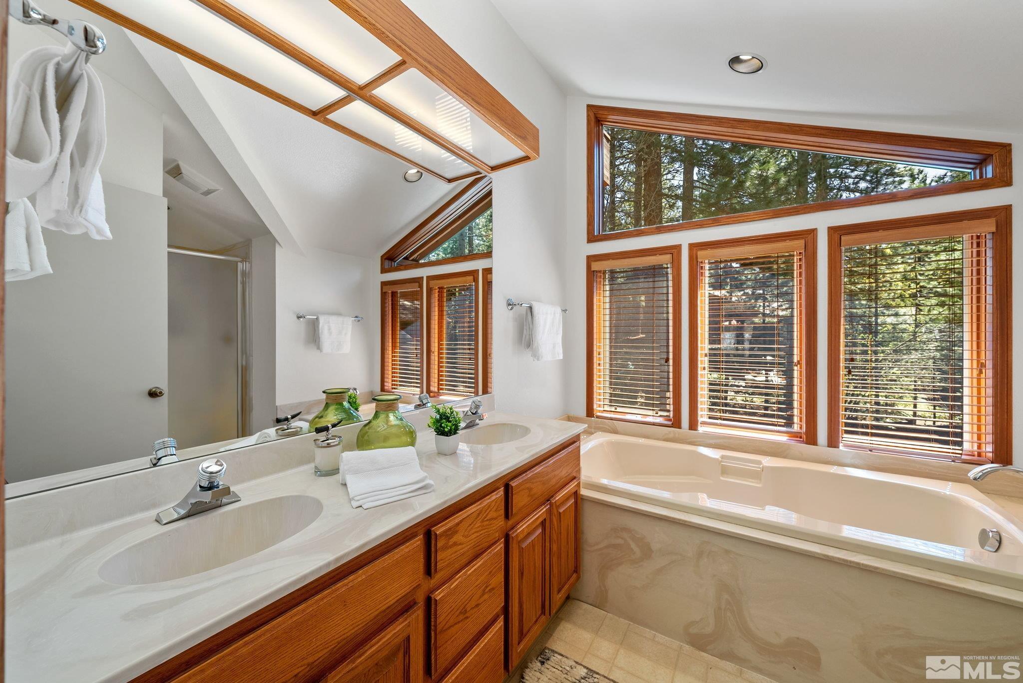 106 Jobs Peak Road Incline Village, NV 89451 - Photo 29 of 40 a spacious bathroom with a granite countertop sink and a large mirror