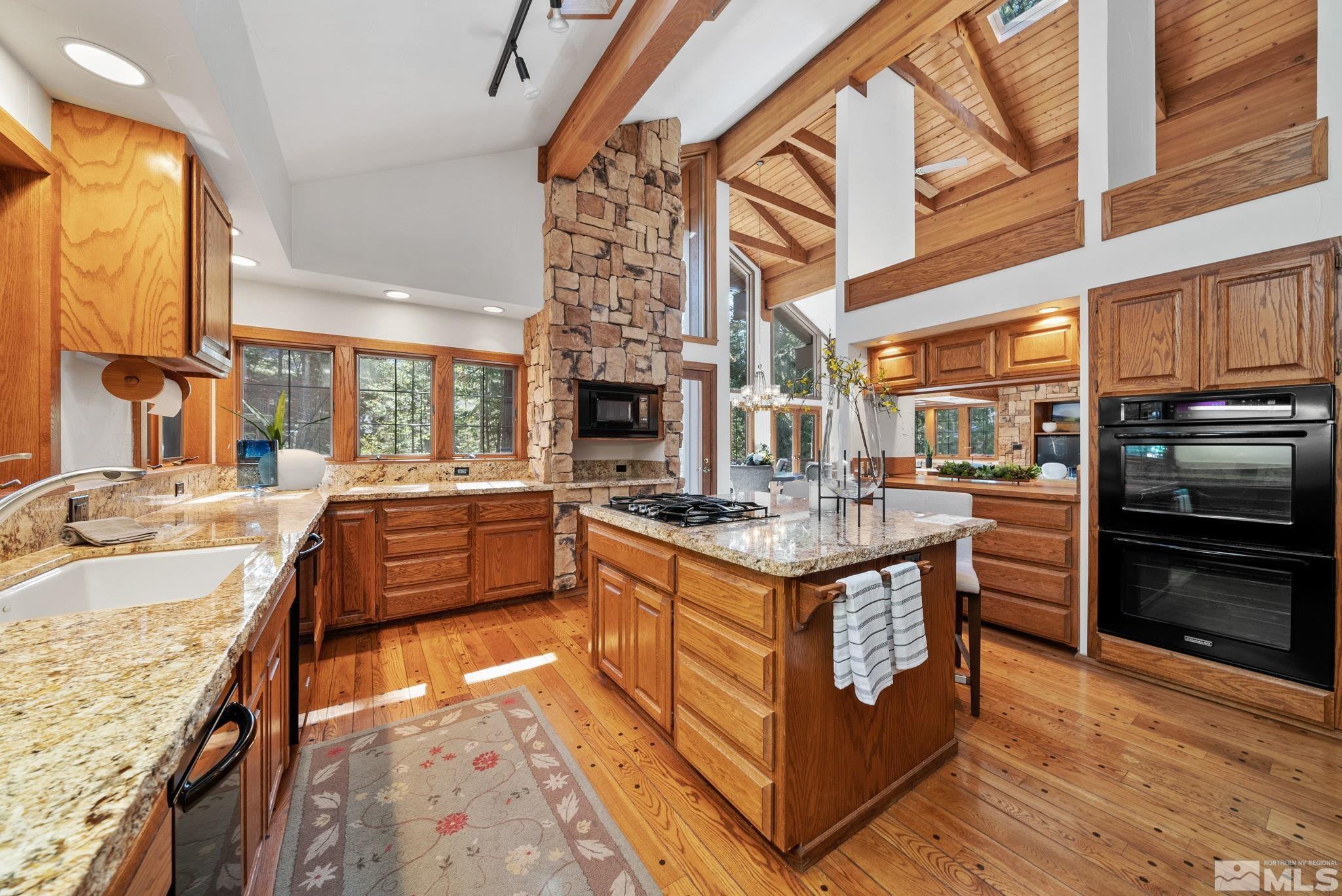 106 Jobs Peak Road Incline Village, NV 89451 - Photo 5 of 40 a kitchen with stainless steel appliances granite countertop a stove and a refrigerator
