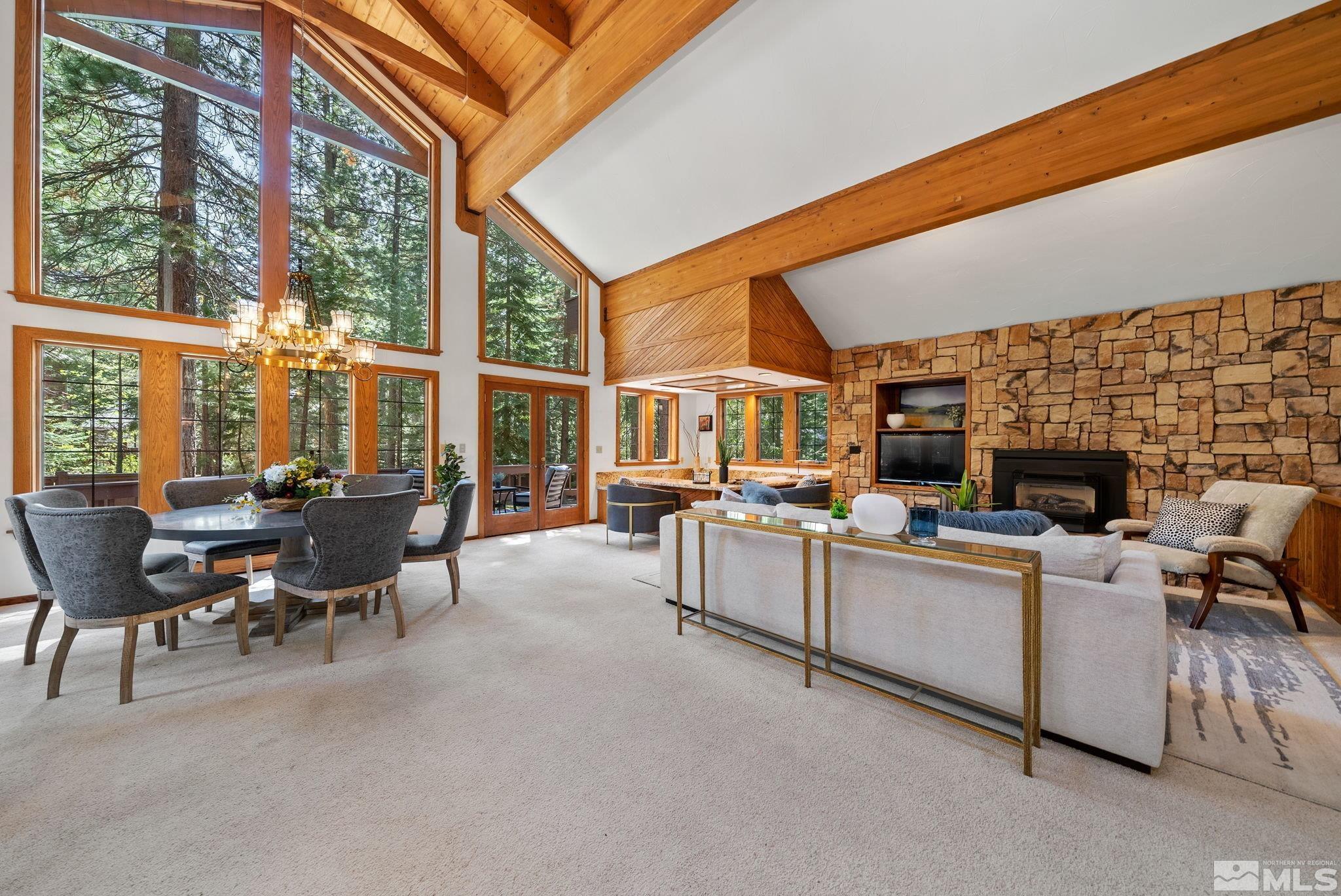 106 Jobs Peak Road Incline Village, NV 89451 - Photo 9 of 40 a living room with furniture a fireplace and floor to ceiling windows