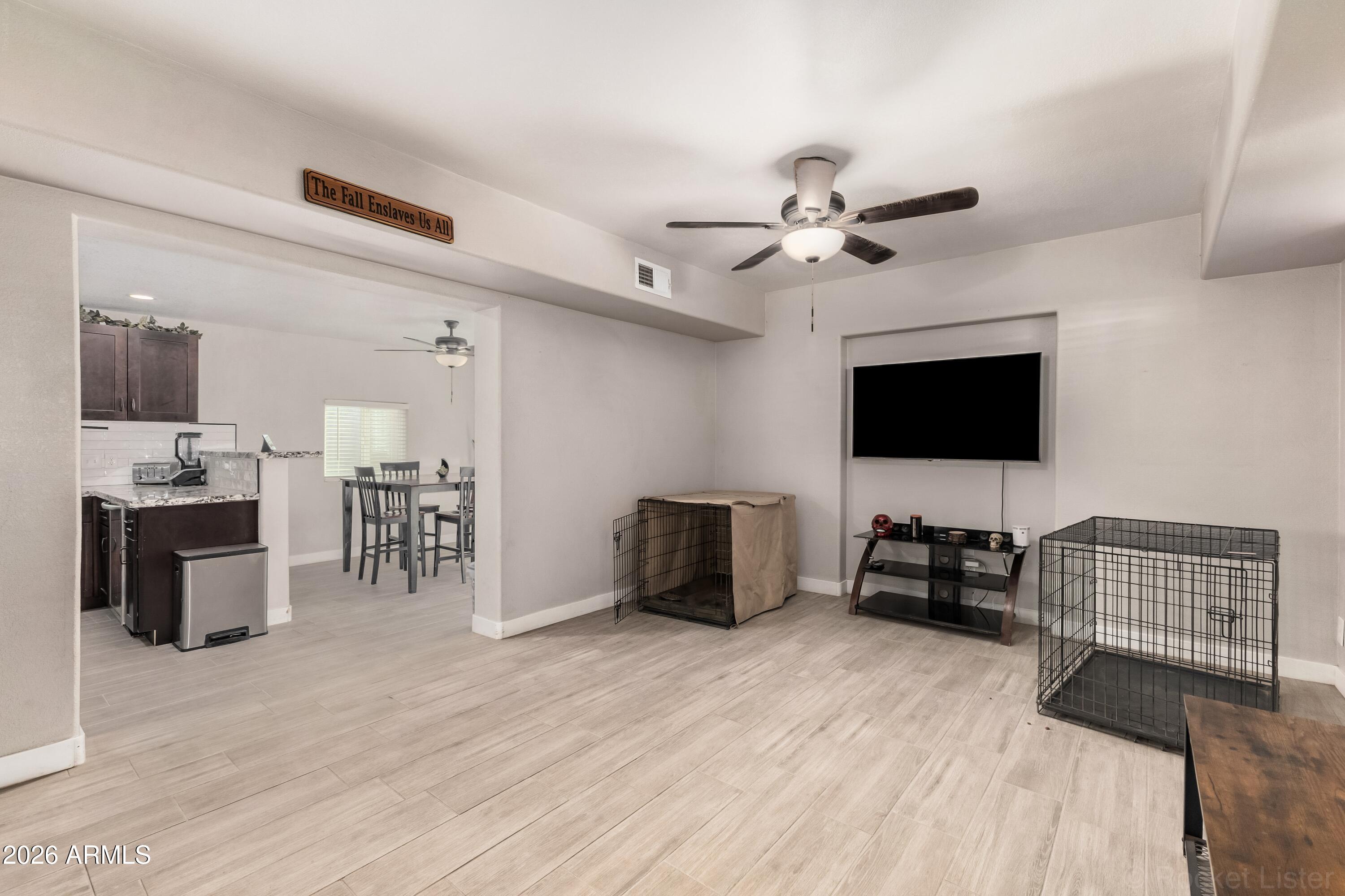 146 South Robson Mesa, AZ 85210 - Photo 14 of 36 a living room with furniture and a flat screen tv