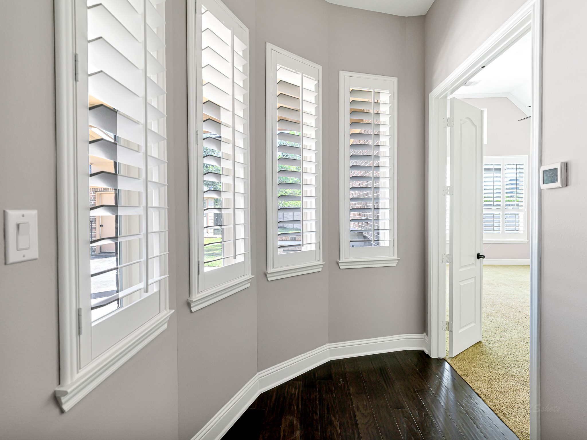 1710 Rice Mill Drive Katy, TX 77493 - Photo 20 of 50 a view of an empty room with wooden floor and a window