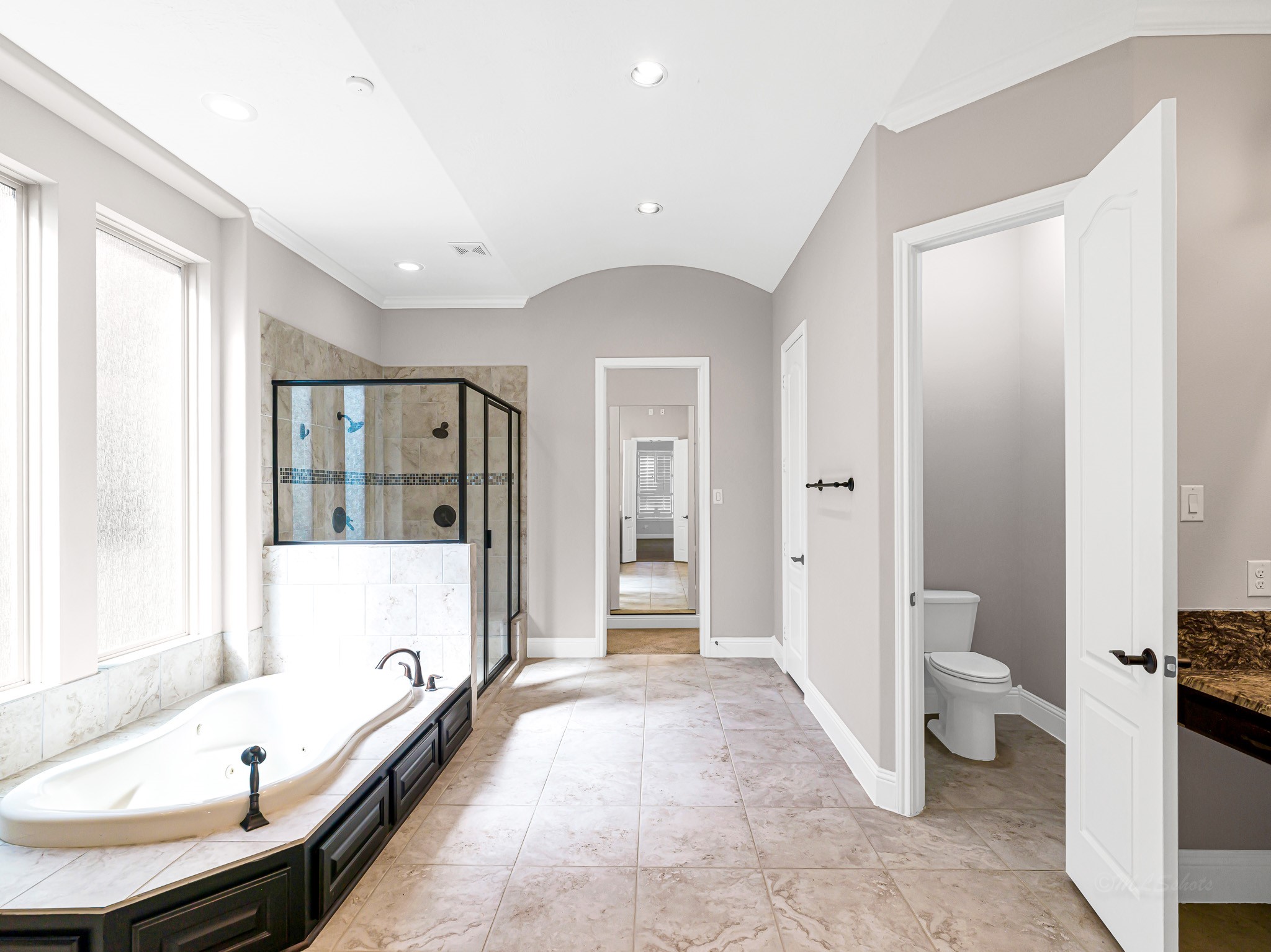 1710 Rice Mill Drive Katy, TX 77493 - Photo 22 of 50 a bathroom with a tub toilet and a shower