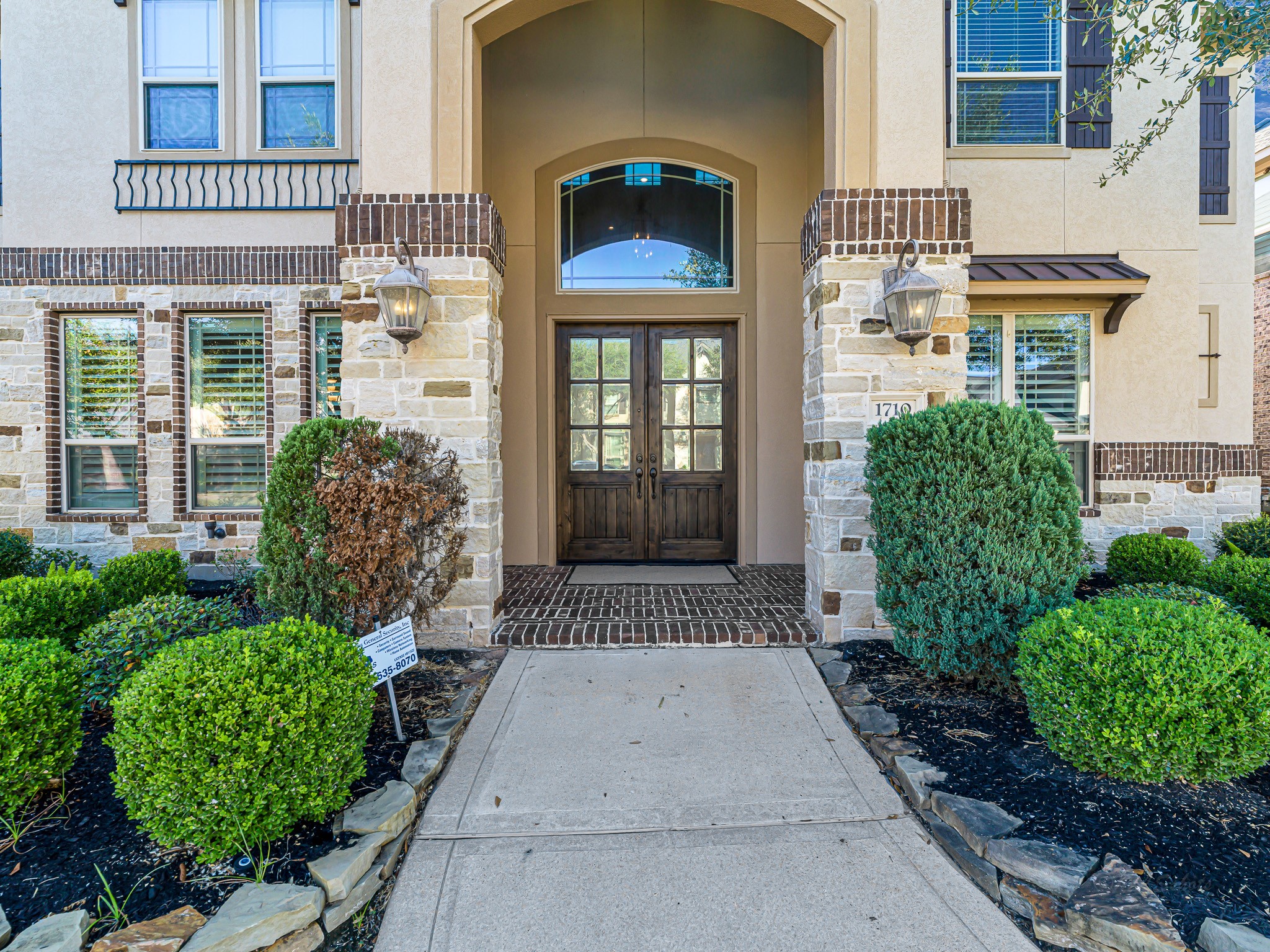 1710 Rice Mill Drive Katy, TX 77493 - Photo 4 of 50 front view of a brick house with a large windows