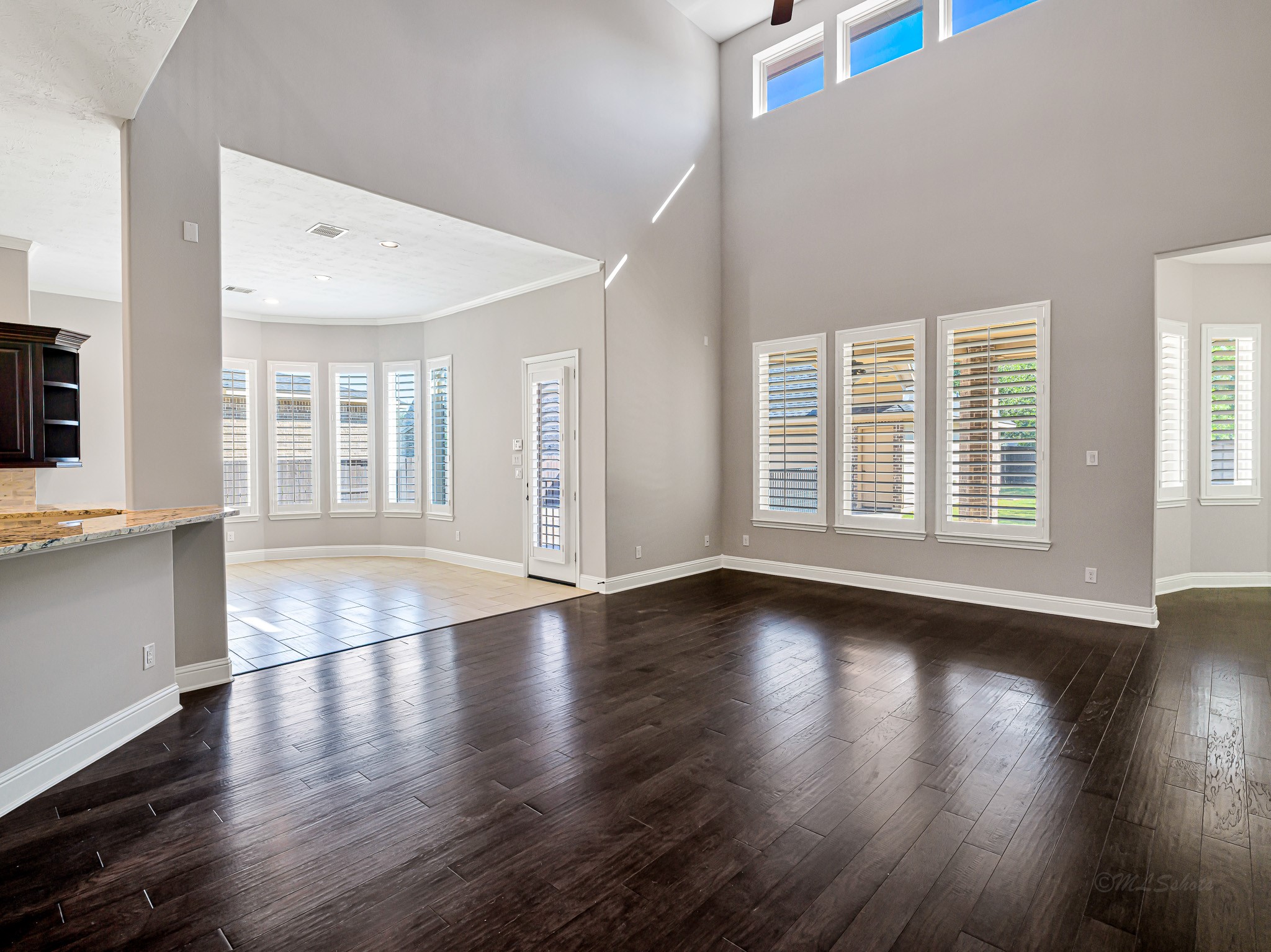 1710 Rice Mill Drive Katy, TX 77493 - Photo 10 of 50 a view of an empty room with wooden floor and a window