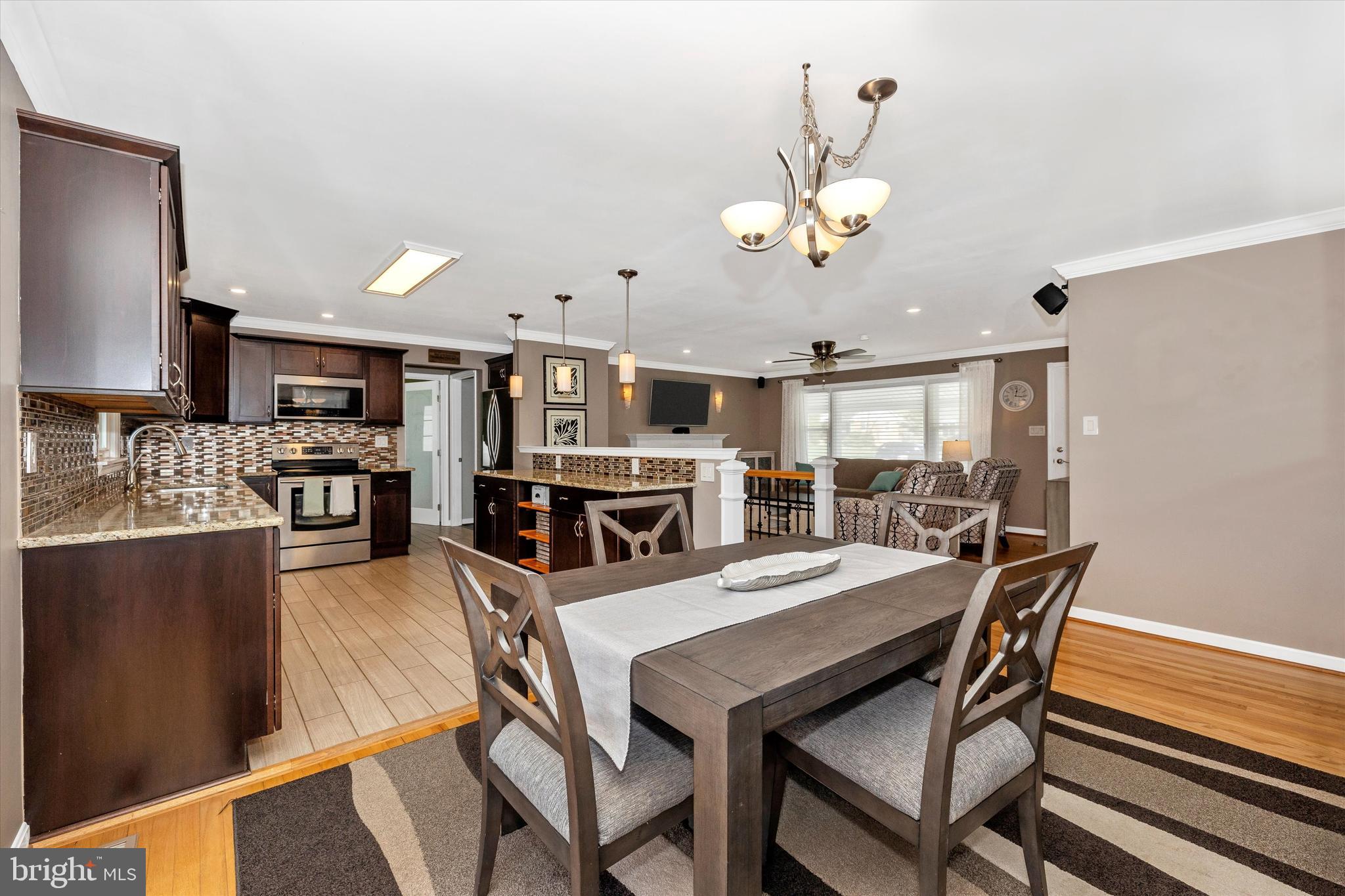 8107 Broadview Drive Frederick, MD 21701 - Photo 11 of 54 a view of a dining room with furniture and a chandelier