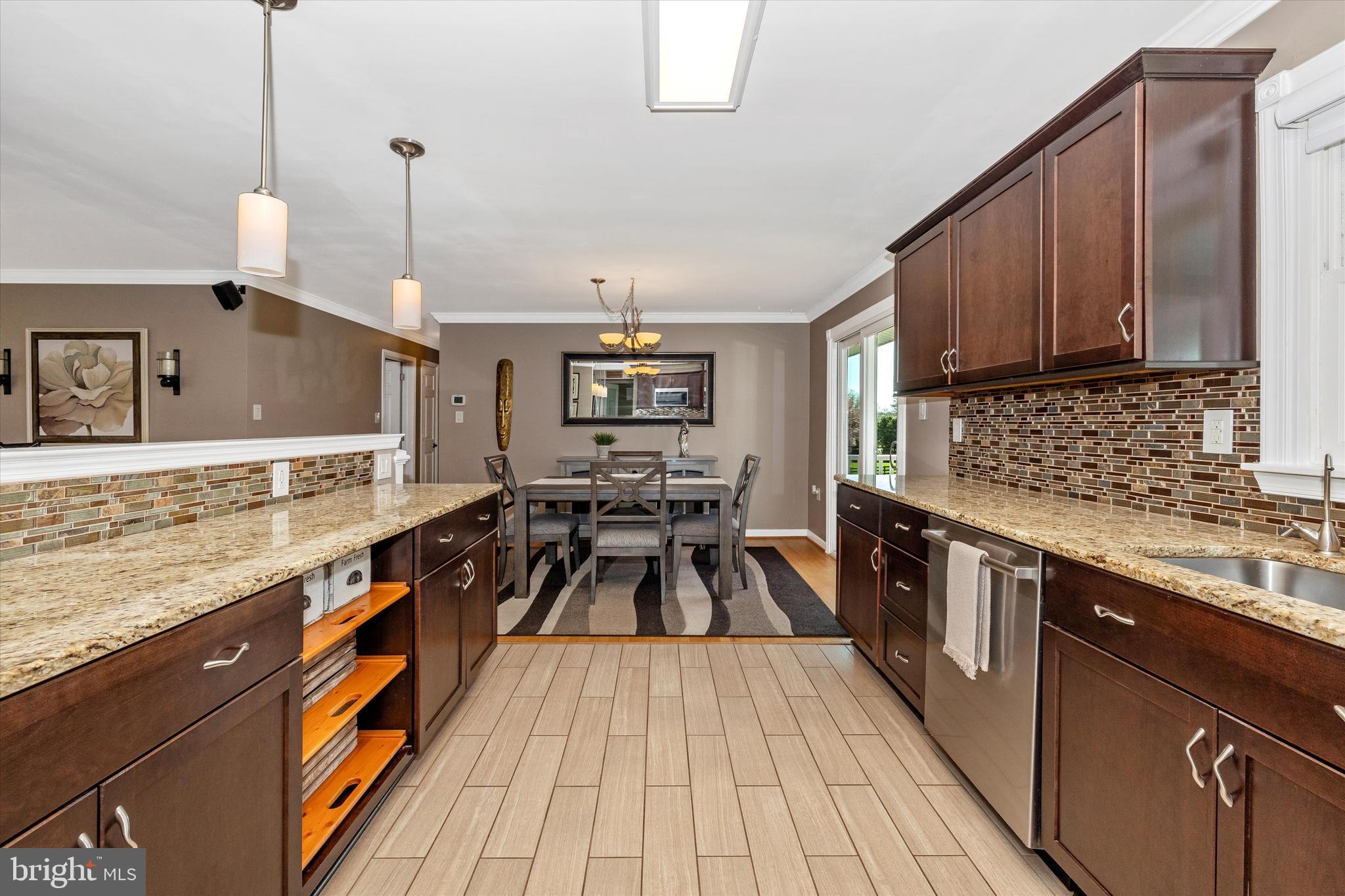 8107 Broadview Drive Frederick, MD 21701 - Photo 17 of 54 a kitchen with granite countertop a sink a counter top space appliances and cabinets