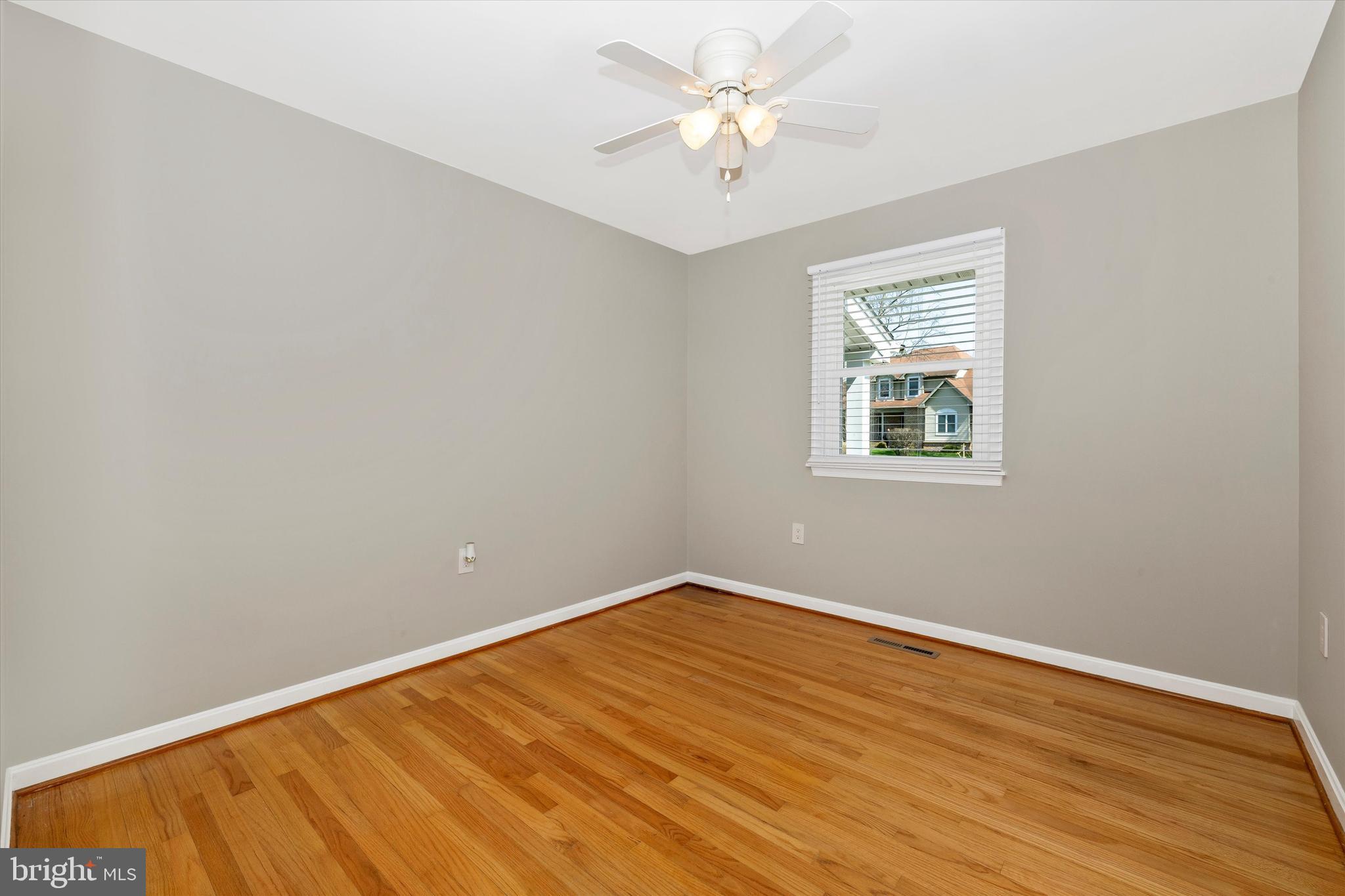 8107 Broadview Drive Frederick, MD 21701 - Photo 27 of 54 wooden floor in an empty room with a window