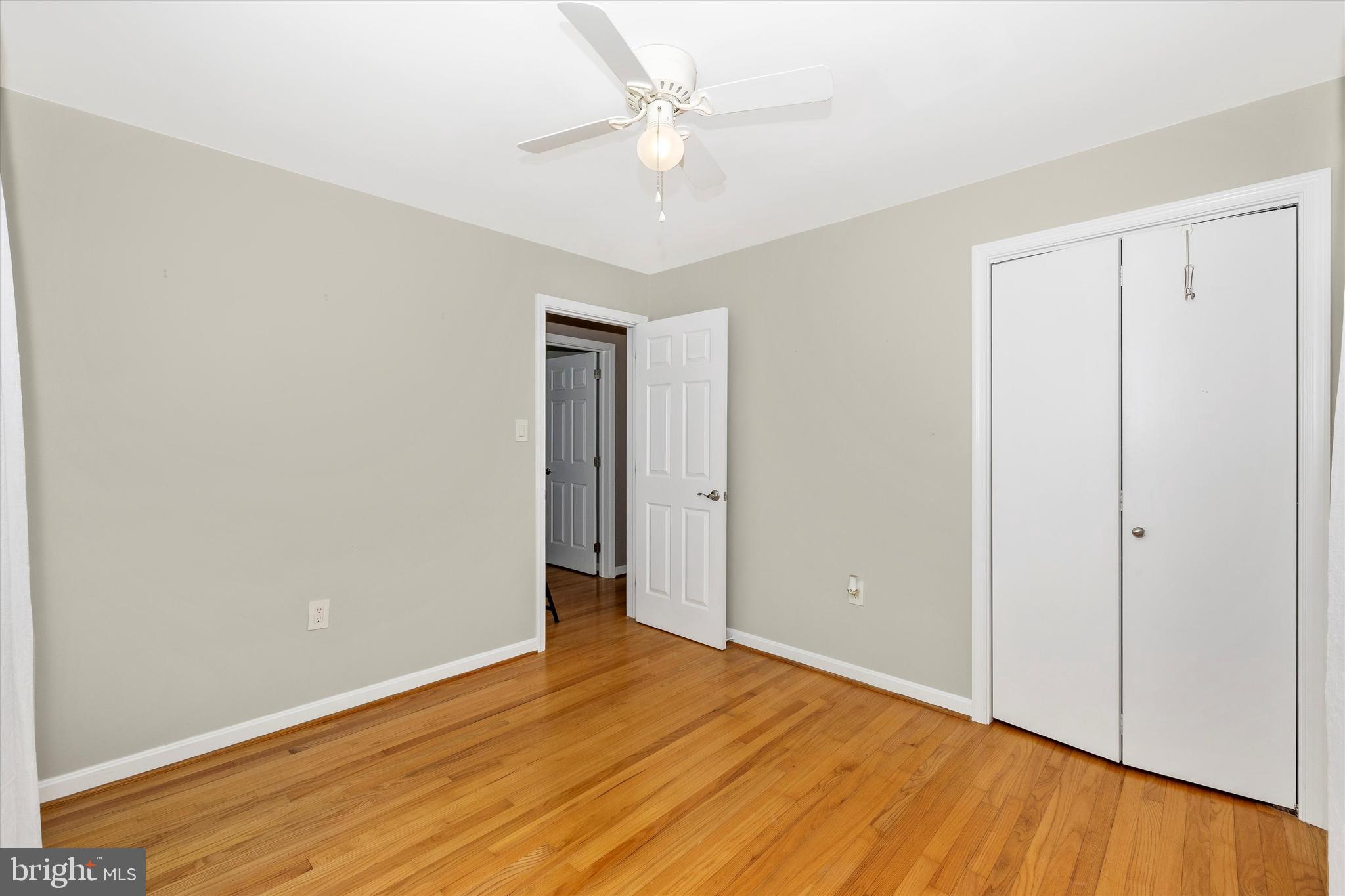 8107 Broadview Drive Frederick, MD 21701 - Photo 28 of 54 an empty room with wooden floor and a ceiling fan