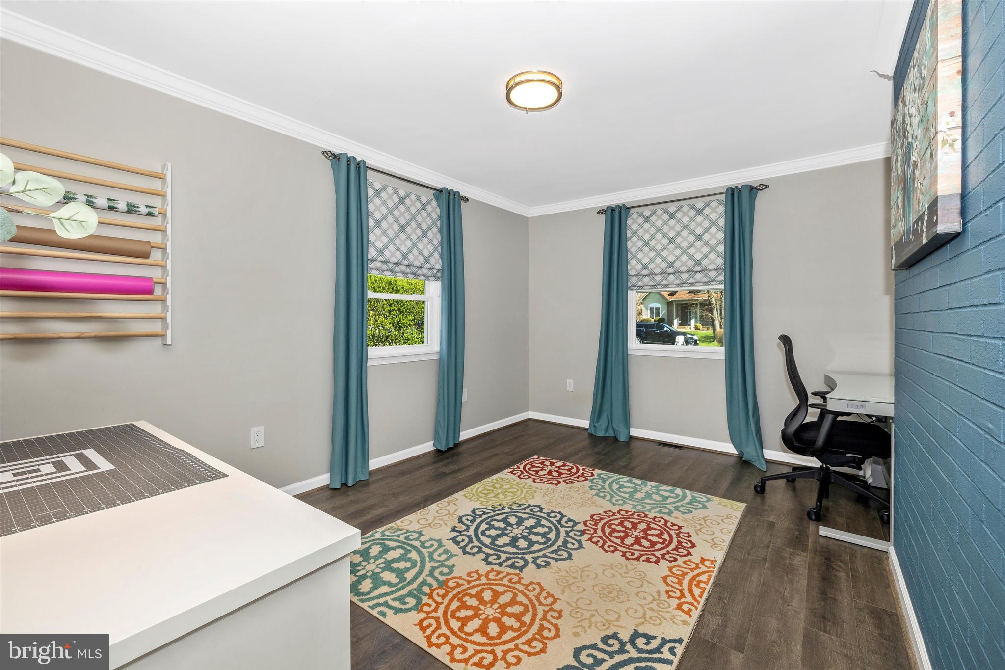 8107 Broadview Drive Frederick, MD 21701 - Photo 30 of 54 a bedroom with a bed and a table in it