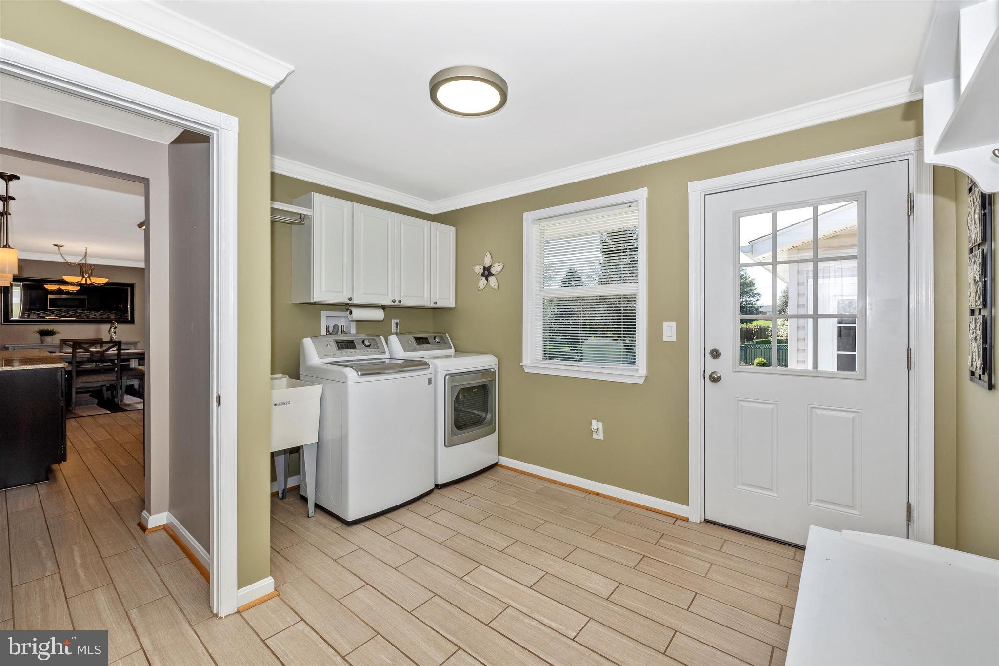 8107 Broadview Drive Frederick, MD 21701 - Photo 32 of 54 a view of a kitchen with a sink and dishwasher with wooden floor