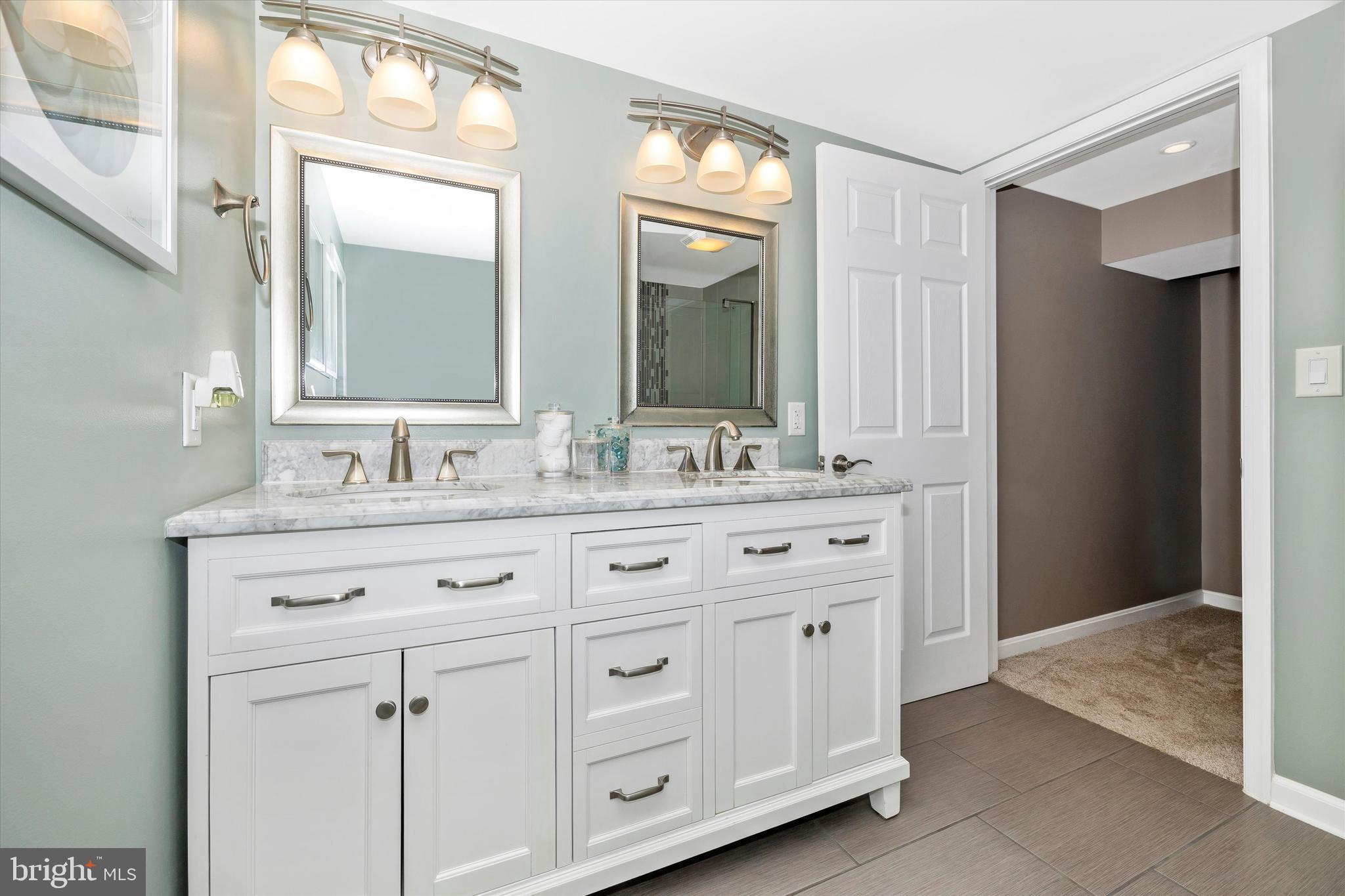 8107 Broadview Drive Frederick, MD 21701 - Photo 33 of 54 a bathroom with a granite countertop sink double and mirror