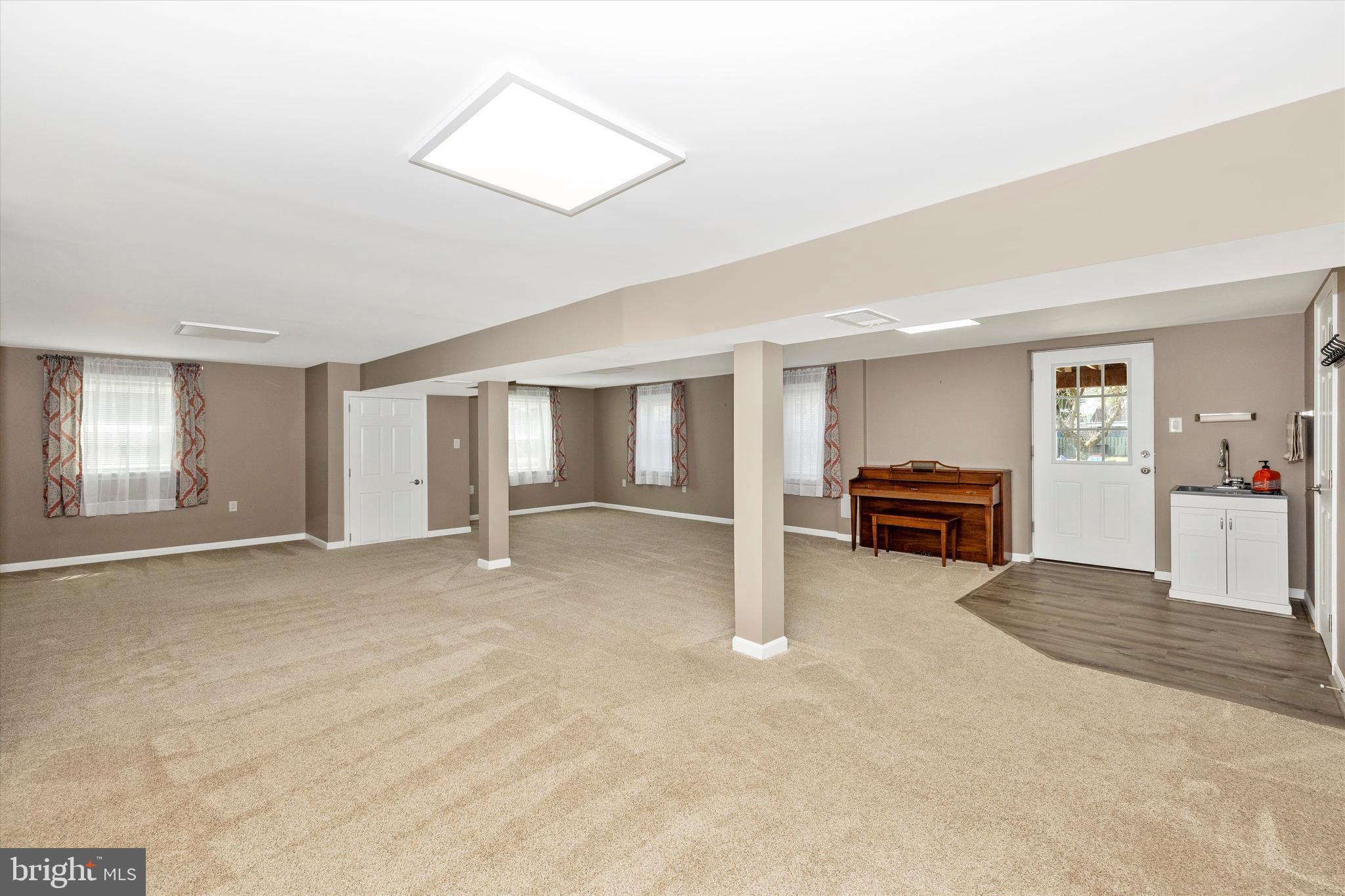 8107 Broadview Drive Frederick, MD 21701 - Photo 38 of 54 a view of an empty room with cabinet and a window