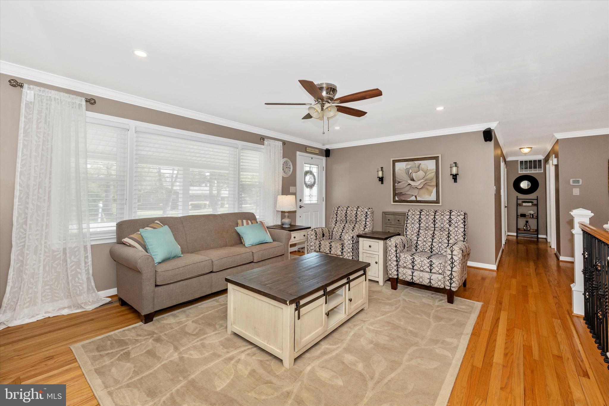 8107 Broadview Drive Frederick, MD 21701 - Photo 8 of 54 a living room with furniture and a wooden floor