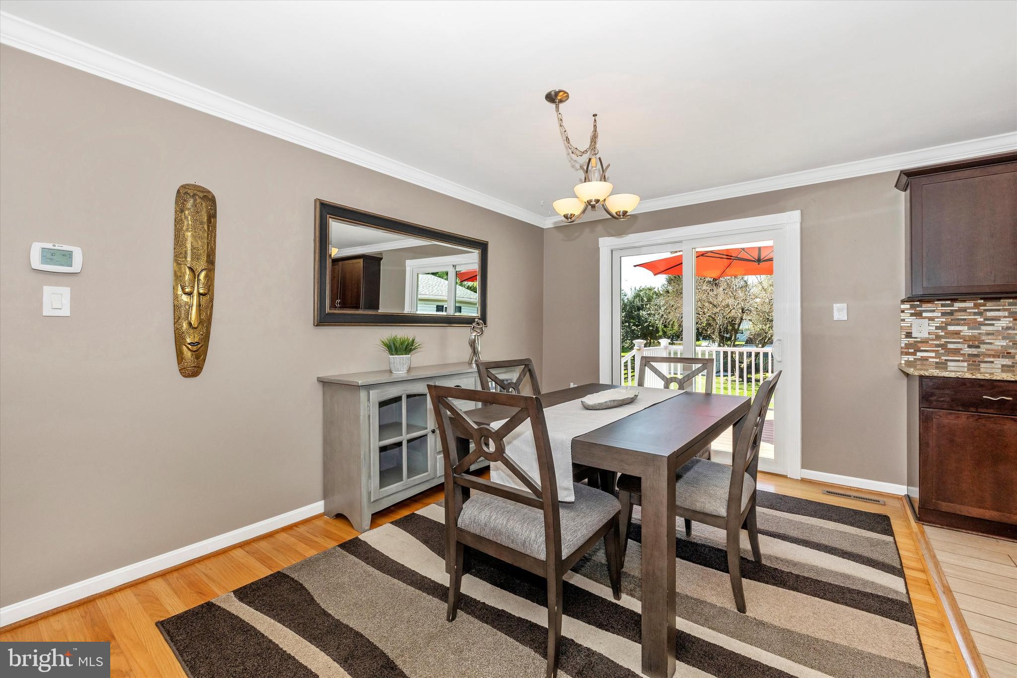 8107 Broadview Drive Frederick, MD 21701 - Photo 9 of 54 a view of a dining room with furniture and chandelier