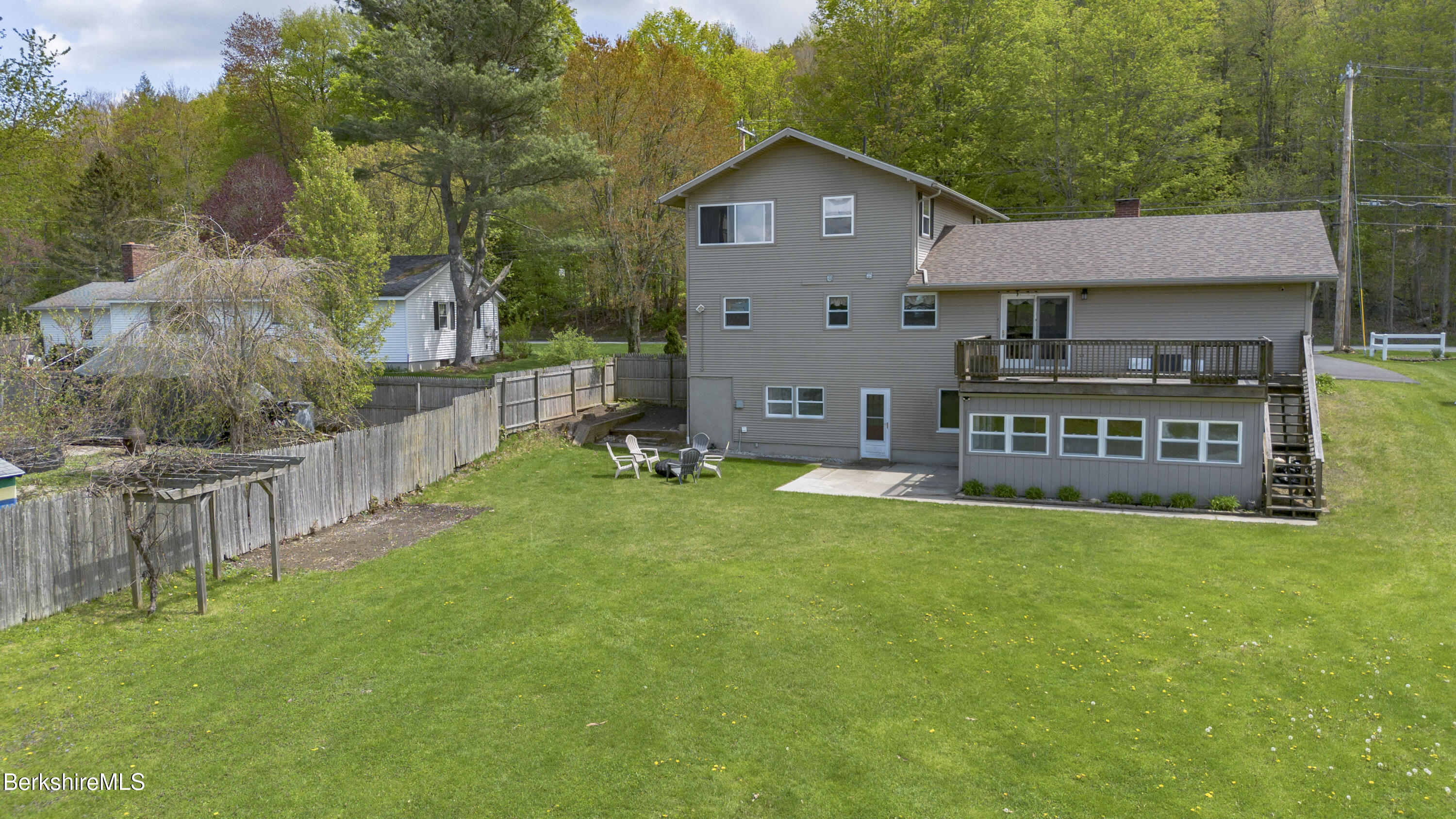 582 East New Lenox Road Pittsfield, MA 01201 - Photo 23 of 23 a view of a house with a yard and sitting area