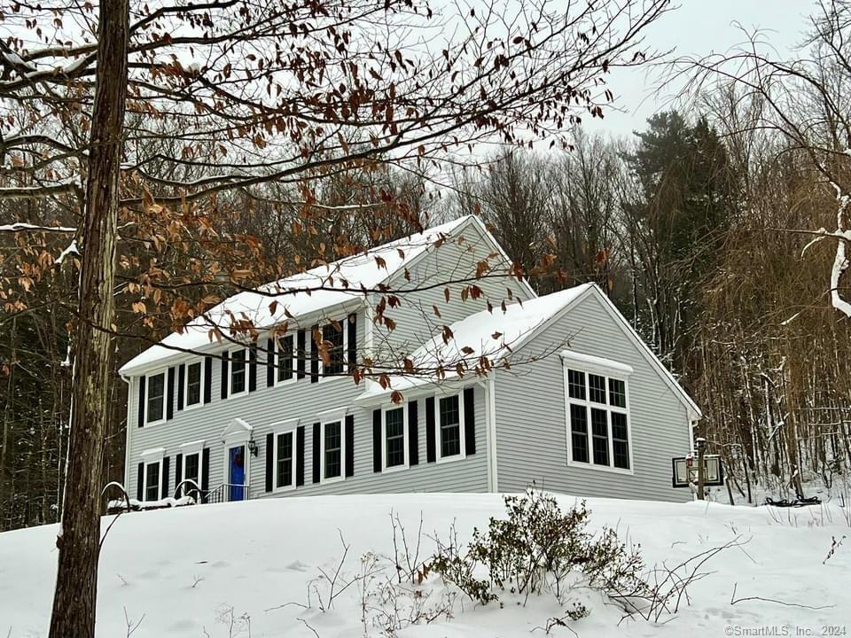 123 Skinner Road Winchester, CT 06098 - Photo 1 of 1 a front view of a house with a yard covered in snow