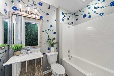 a view with a sink and a mirror