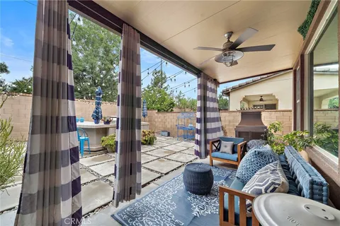 a view of swimming pool with outdoor seating and city view
