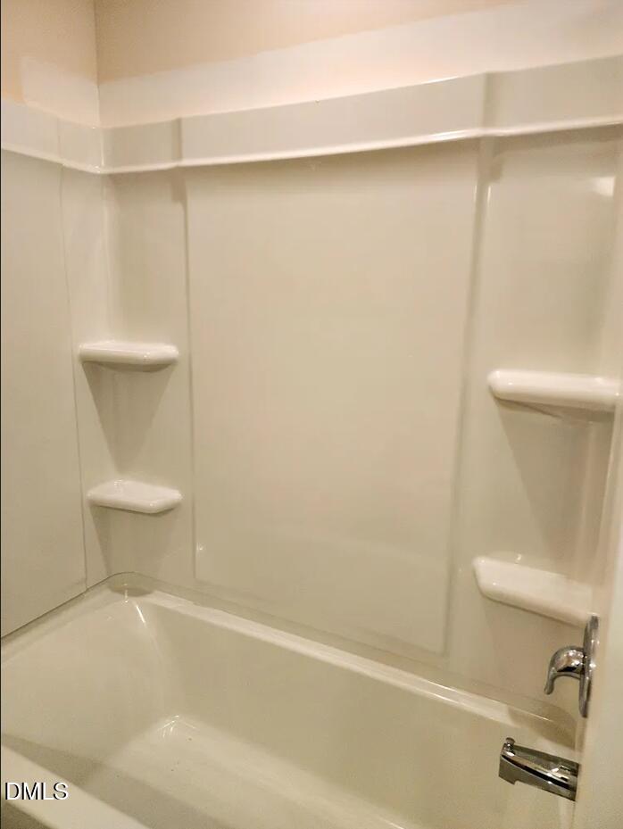 237 Truss Bridge Street Fuquay-Varina, NC 27526 - Photo 20 of 20 a bathroom with a shower and a toilet