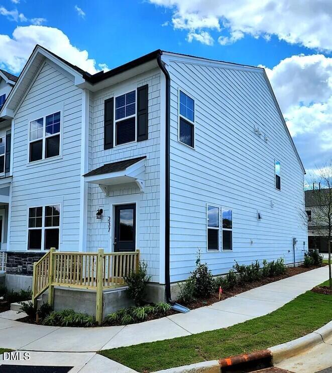 237 Truss Bridge Street Fuquay-Varina, NC 27526 - Photo 2 of 20 a front view of a house with a yard