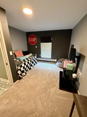 a bedroom with furniture and a gate