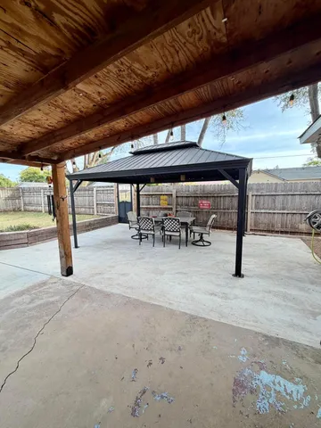a view of a parking garage with a table and chairs