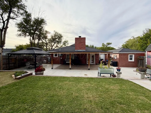a view of a house with sitting area and furniture