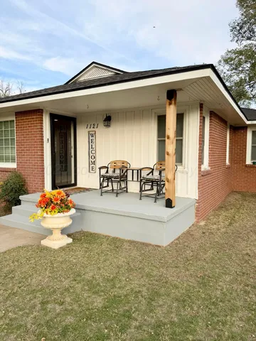 a view of a house with outdoor seating