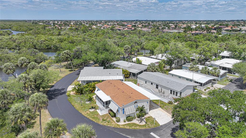 10303 Burnt Store Road, Unit 143 Punta Gorda, FL 33950 - Photo 32 of 42 an aerial view of a house with a garden