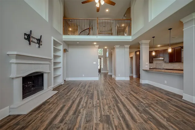 a view of an entryway with wooden floor