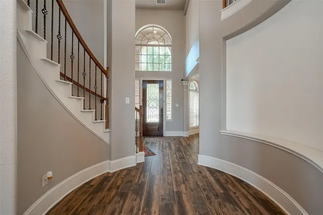 a view of entryway with wooden floor