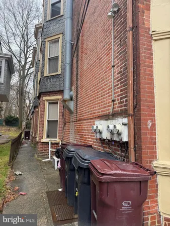 a backyard of a house with outdoor seating