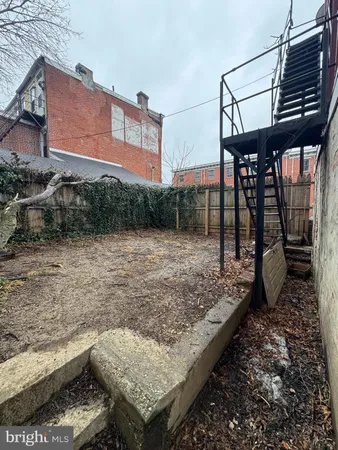 a view of a backyard with sitting area