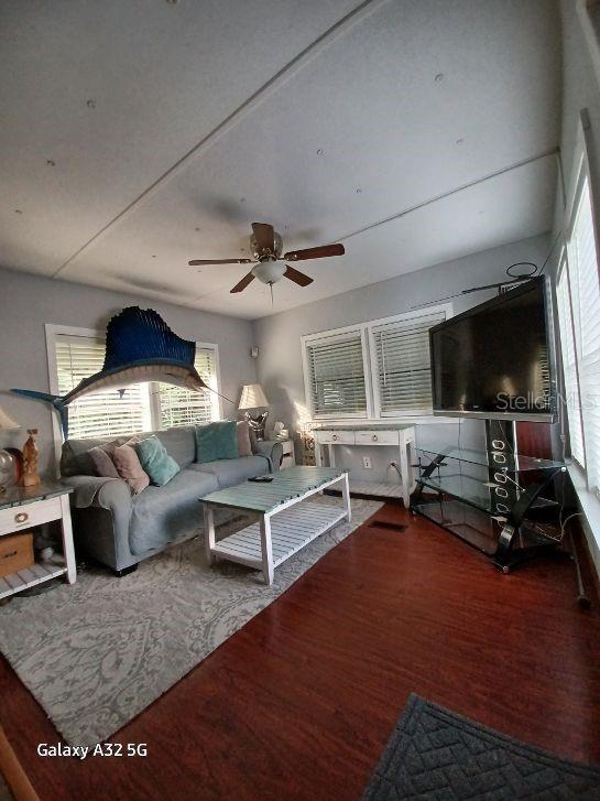 1286 Southwest Tropical Terrace Stuart, FL 34997 - Photo 14 of 28 a living room with furniture and a flat screen tv