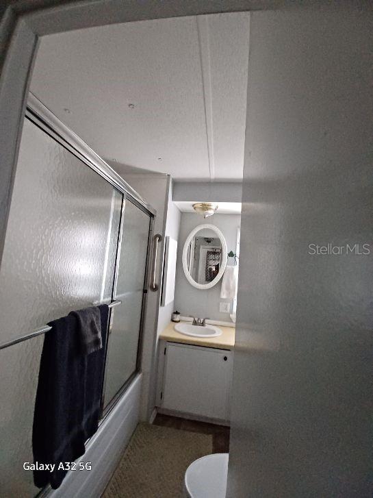 1286 Southwest Tropical Terrace Stuart, FL 34997 - Photo 18 of 28 a bathroom with a sink a toilet and a mirror