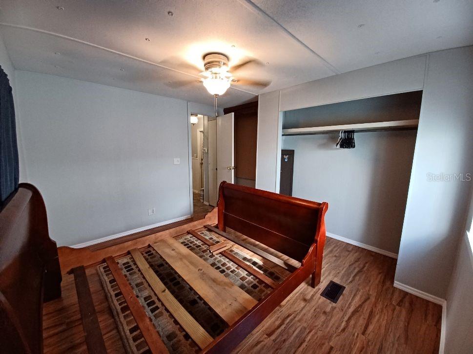 1286 Southwest Tropical Terrace Stuart, FL 34997 - Photo 21 of 28 a view of an empty room with wooden floor