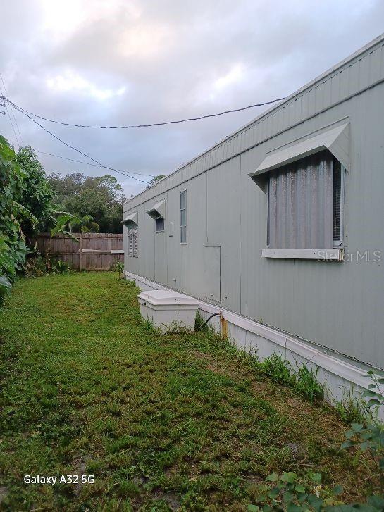 1286 Southwest Tropical Terrace Stuart, FL 34997 - Photo 8 of 28 a backyard with garden