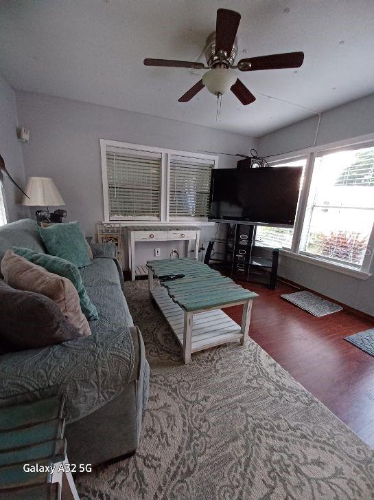 1286 Southwest Tropical Terrace Stuart, FL 34997 - Photo 10 of 28 a living room with furniture and a flat screen tv