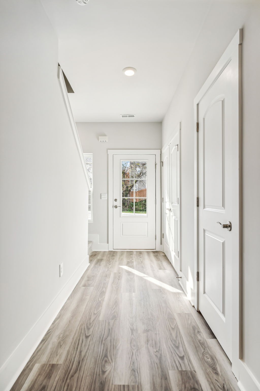 539 Tulip Springs Road Hermitage, TN 37076 - Photo 9 of 69 a view of an empty room with wooden floor and a window