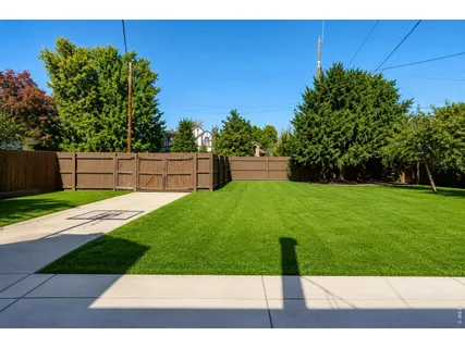 a backyard of a house with lots of green space