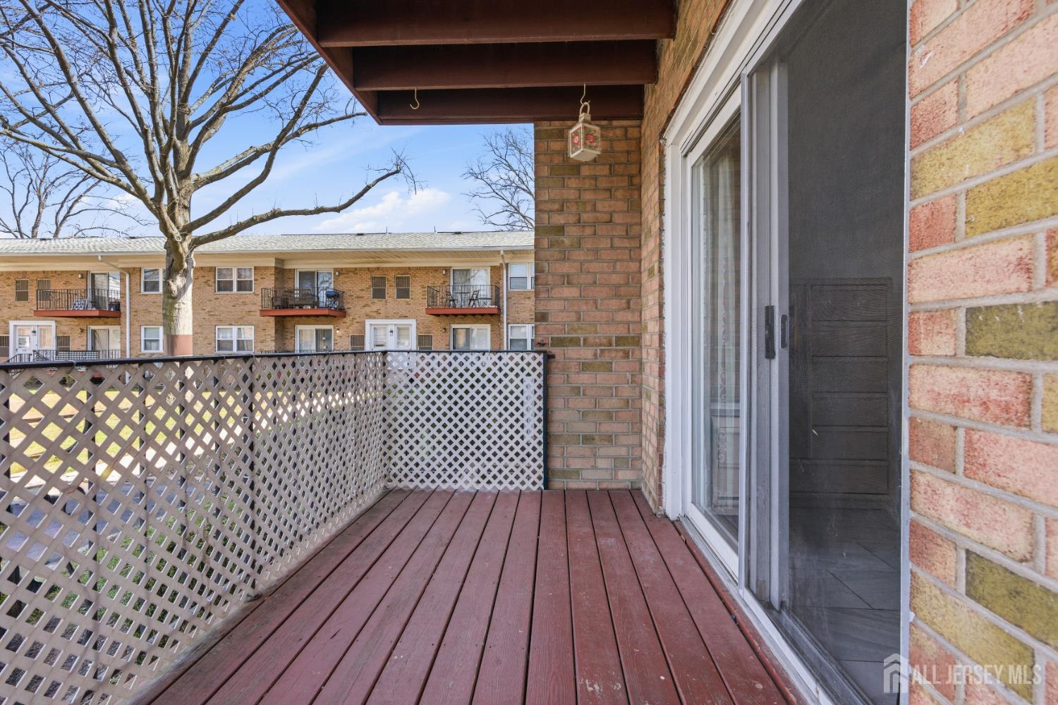 161 Evergreen Road, Unit 2A Edison, NJ 08837 - Photo 15 of 15 a view of a house with a deck
