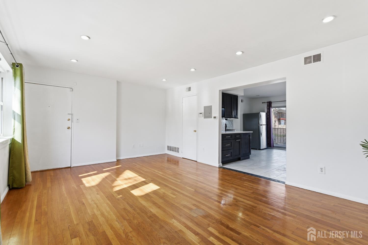 161 Evergreen Road, Unit 2A Edison, NJ 08837 - Photo 6 of 15 a view of a livingroom with wooden floor