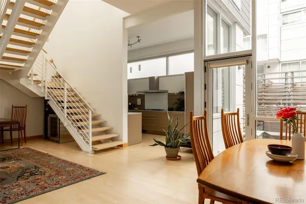 a view of a livingroom with furniture and staircase