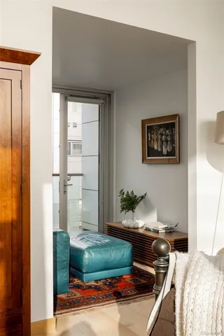 a bedroom with a bed and a mirror