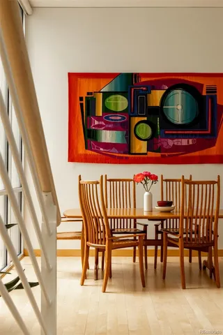 a view of a dining room with furniture wooden floor and window