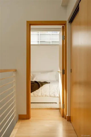 a bedroom with a bed and a closet