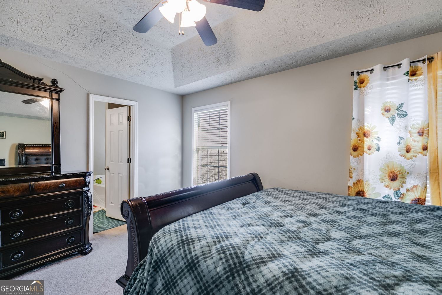 674 Fairview Drive Dallas, GA 30157 - Photo 15 of 24 a bedroom with a bed and a flat tv screen on dresser